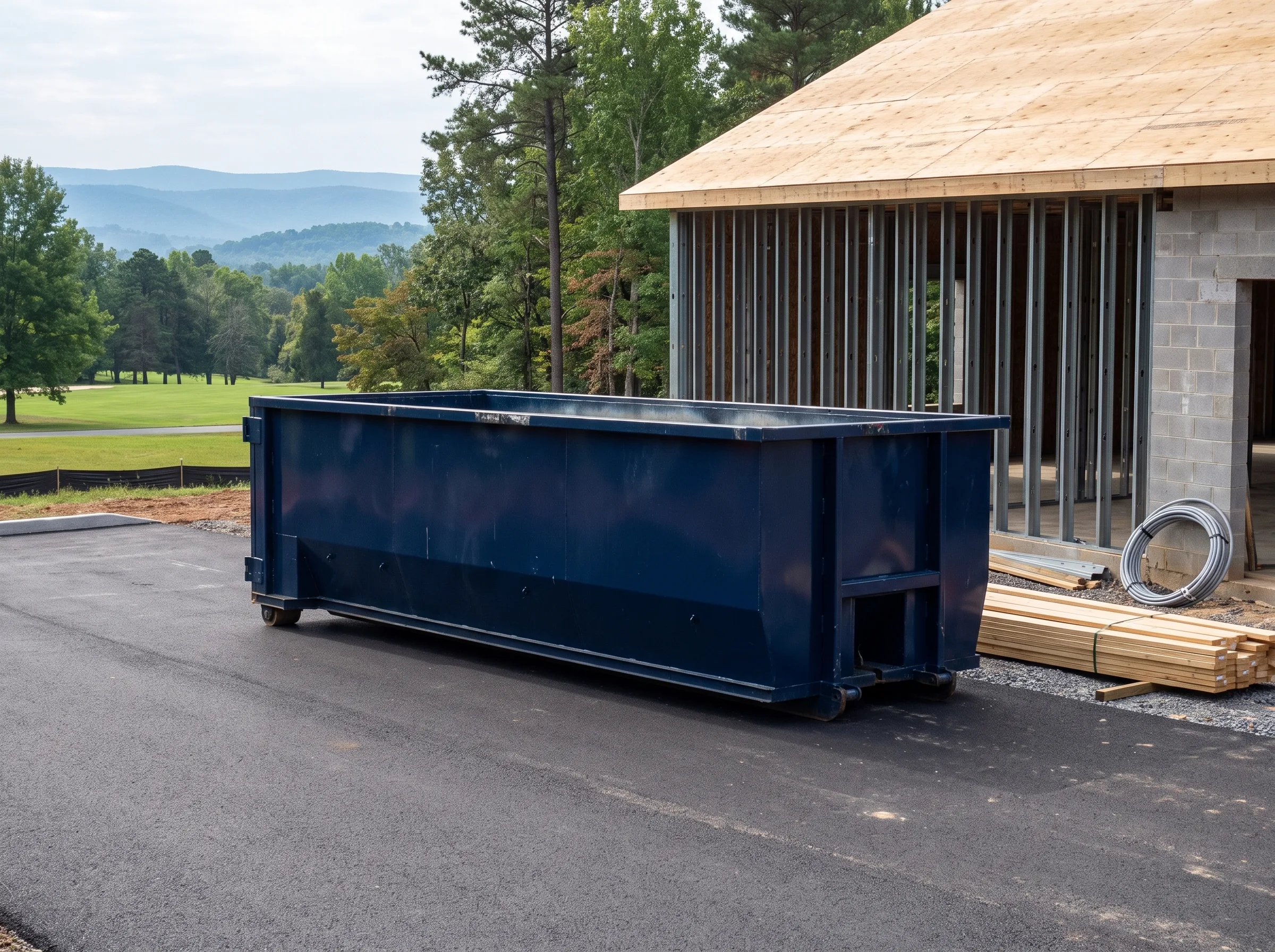 Roll-off dumpster being loaded in Bear, DE